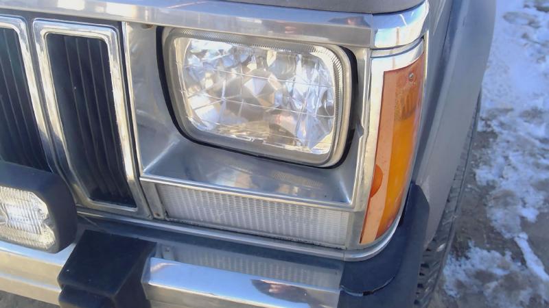 1984-1992 Jeep Cherokee Headlight Door LH