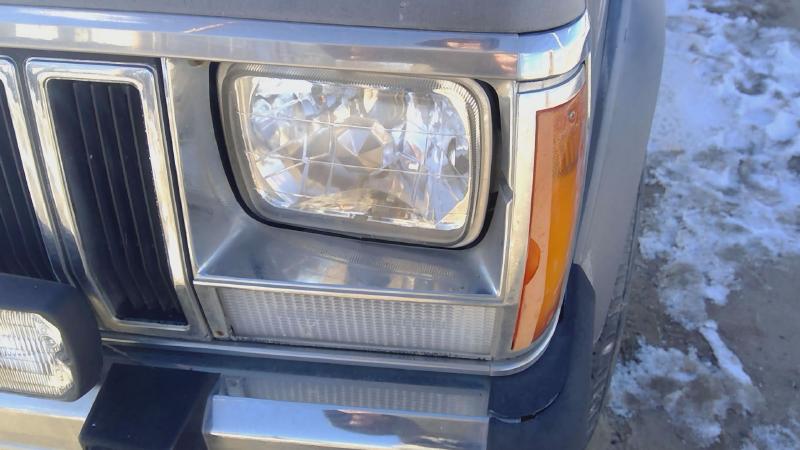 1984-1992 Jeep Cherokee Headlight Door LH